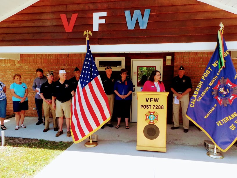 Brunswick County Chamber of Commerce President, Shannon Viero, addresses members of VFW Calabash Post #7288 during the ribbon cutting ceremony on May 1st, 2018.
